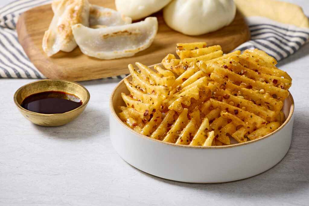 Waffle fries coated in Chili Crisp CrispKeeper from Rubix Foods.